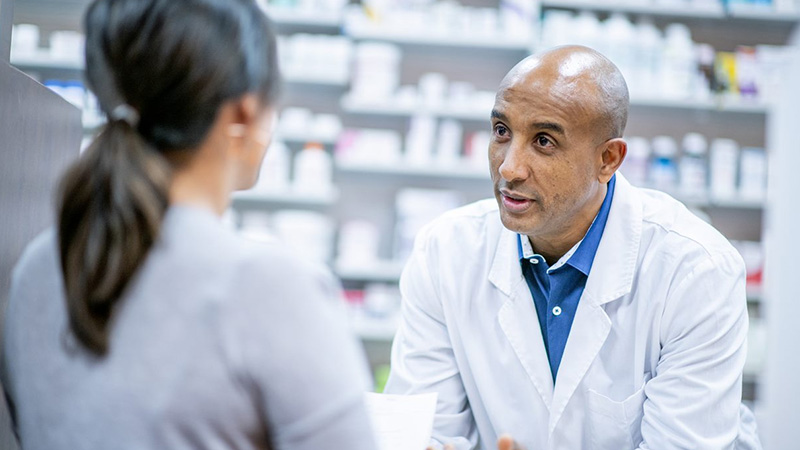 pharmacist consultation with patient in pharmacy pharmacist consultation with patient in pharmacy