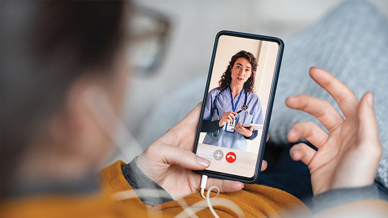 woman on video visit with doctor woman on video visit with doctor at independent pharmacy