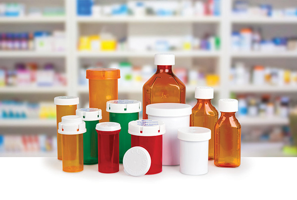 berry global pill bottles on a counter in a pharmacy