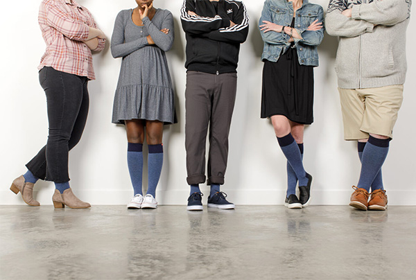 5 different people wearing vim and vigr compression legwear