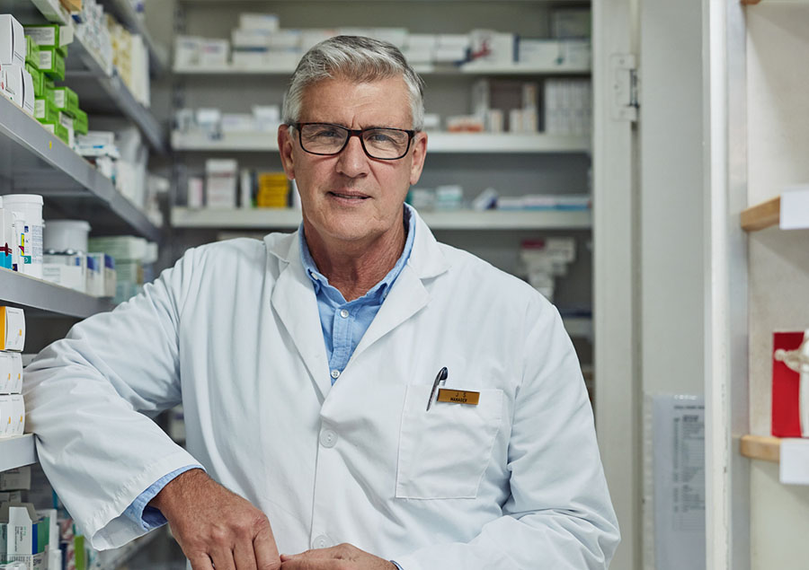 older male pharmacist in independent pharmacy