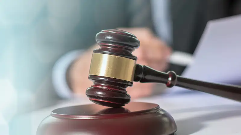gavel in front of businessman