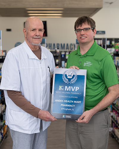 Chip & Michael Andes holding MVP Award